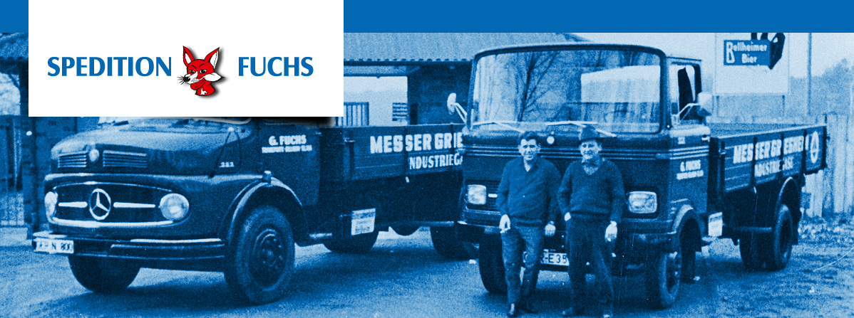 Firmengründer Fuchs und ein Mitarbeiter vor zwei LKW